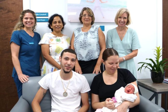 Members of the Integra Newborn and OBGYN team with Parents and baby Ava